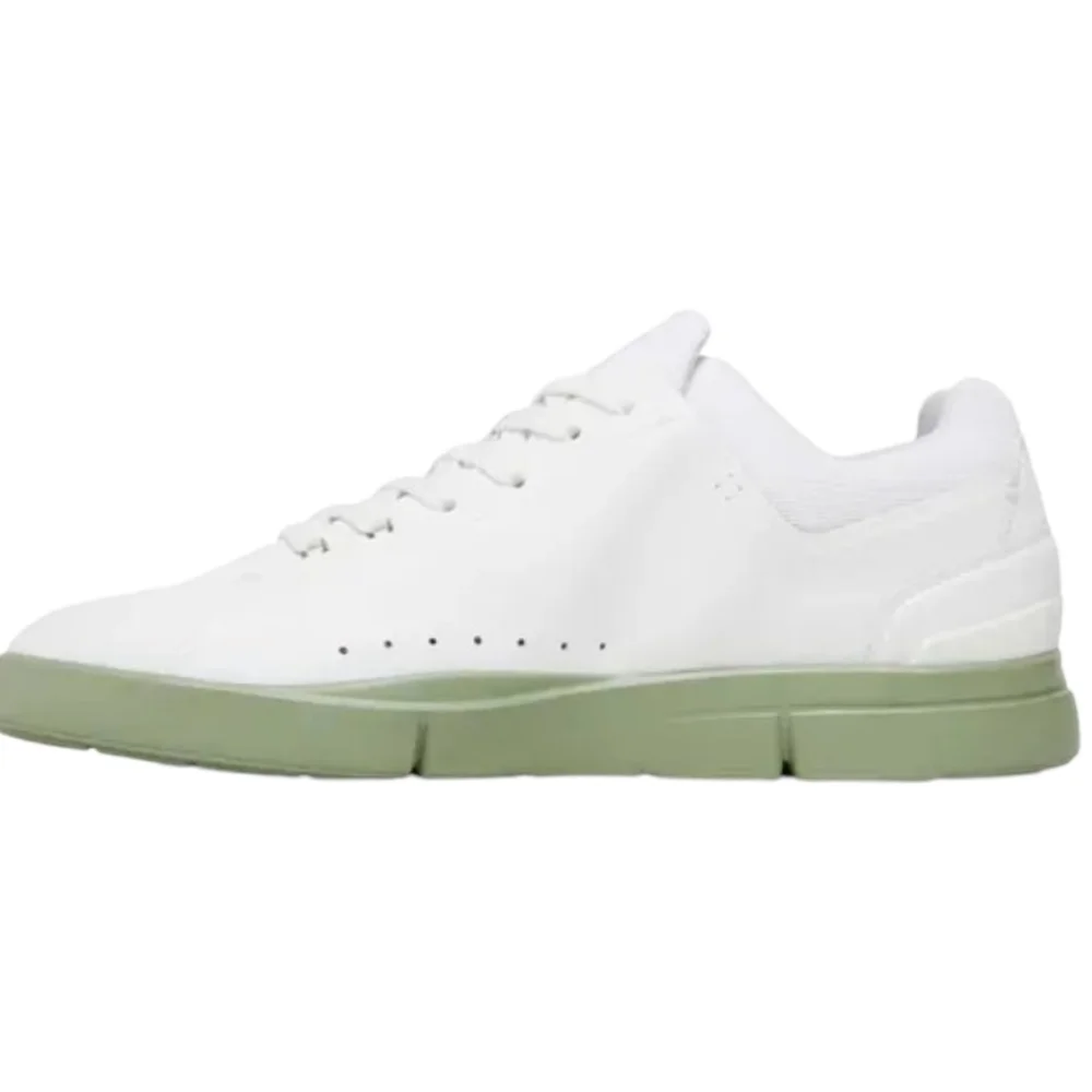 On Running The Roger sneakers in white with mint accent sole. Size 9